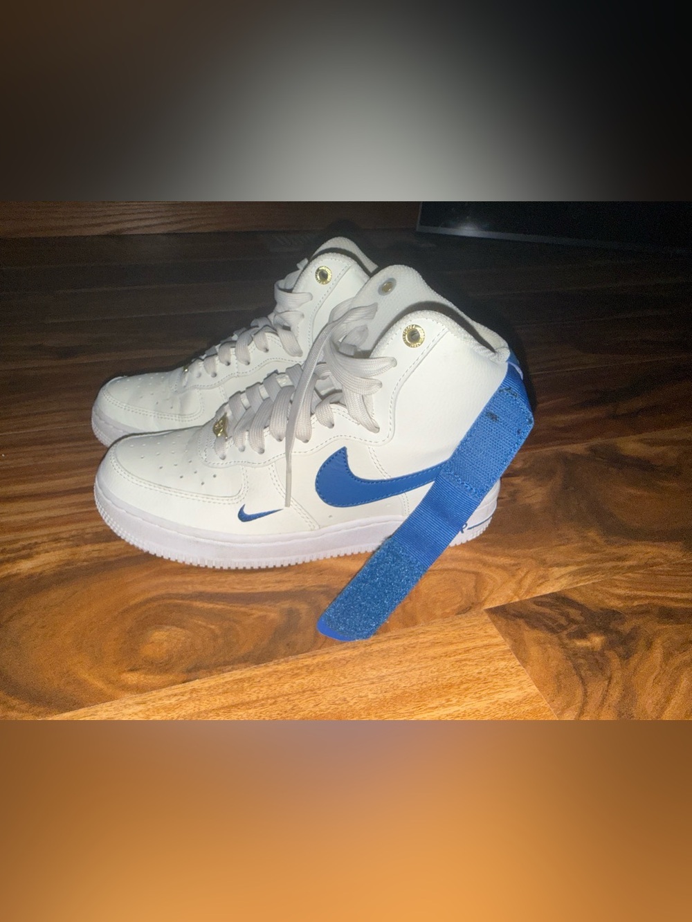 Nike White High-Top Sneakers with Blue Swoosh and Strap